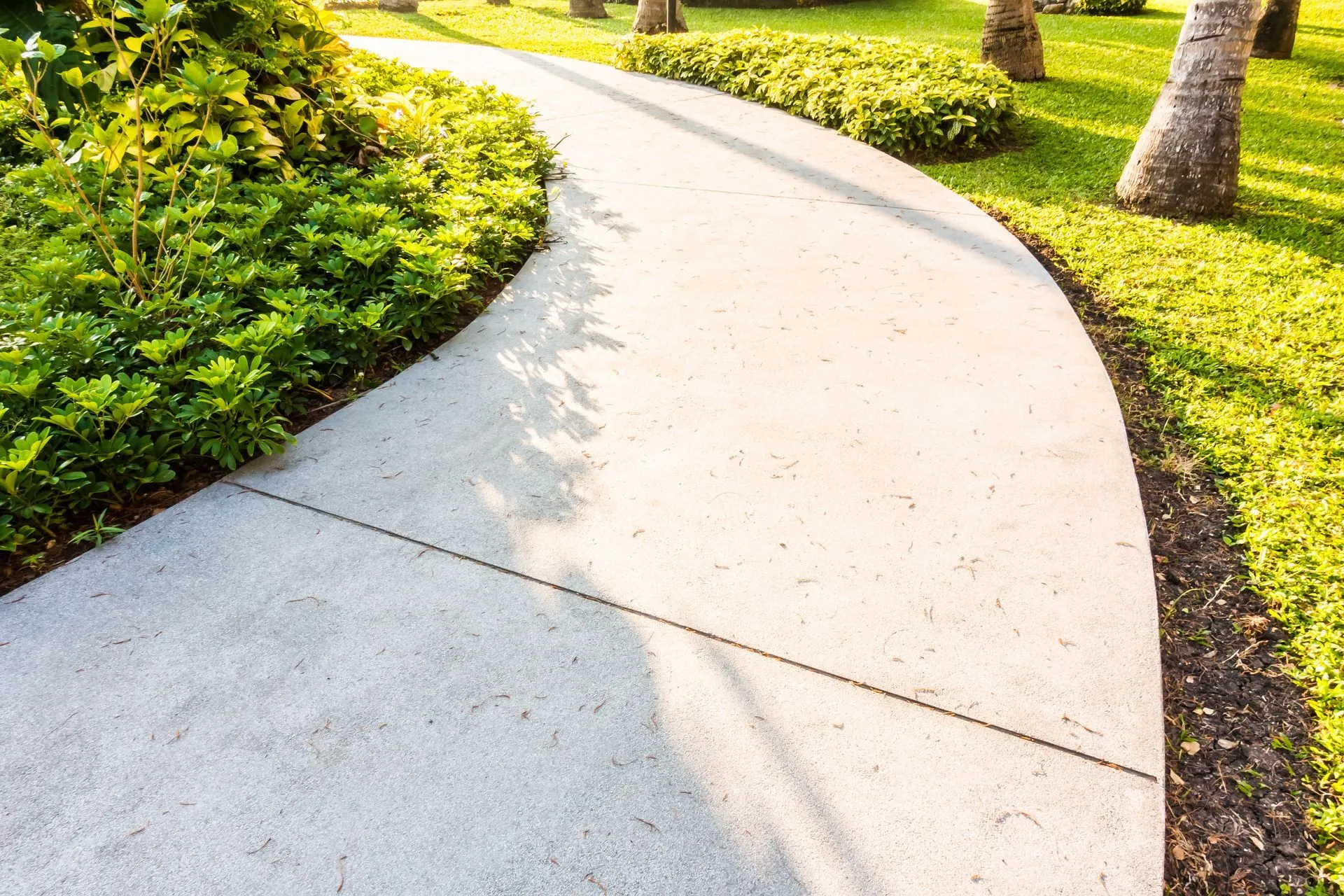 Stone pathway through a landscaped Durham garden